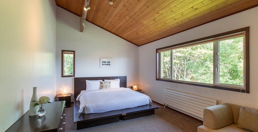 Casa La Mount  - Restful guest bedroom with a forest view